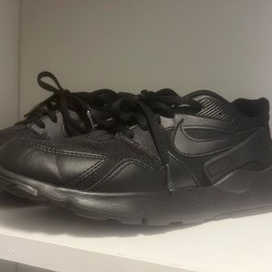 Women’s black Nike sneakers